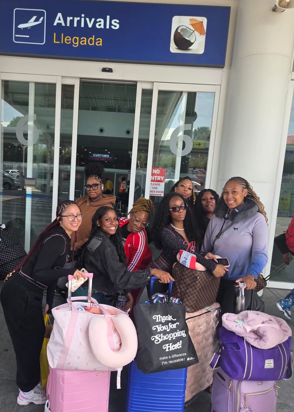 ​Group of travelers receiving meet and greet airport taxi transfer in Antigua.
